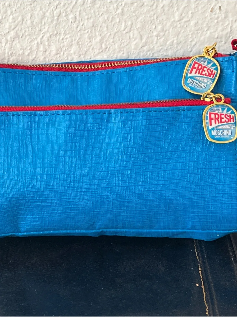 Moschino Bright Blue Cosmetic Pouch with Red Trim and 'Fresh' Charms